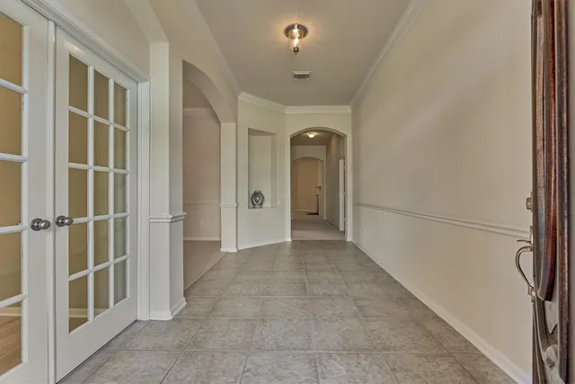 a view of a hallway with closet area