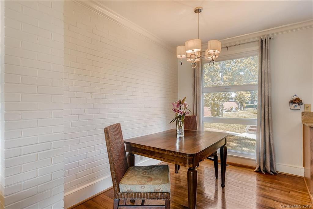 4214 Randolph Road Charlotte, NC 28211 - Photo 5 of 17 a view of a dining room with furniture window and wooden floor