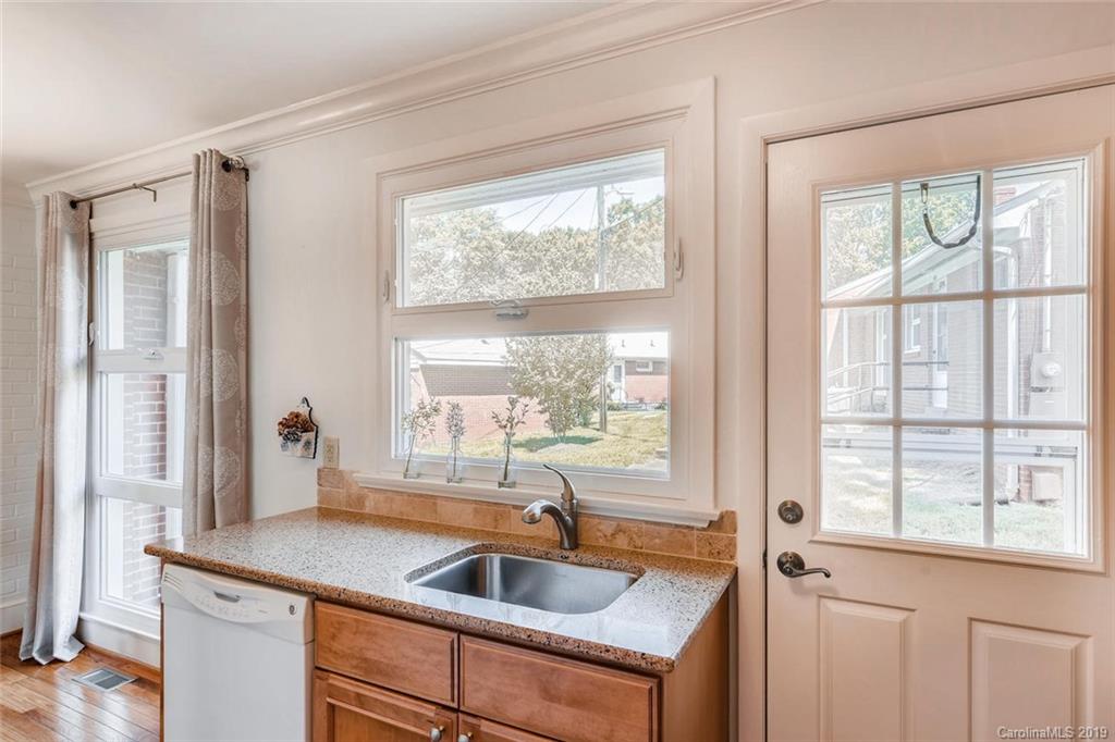 4214 Randolph Road Charlotte, NC 28211 - Photo 8 of 17 a kitchen with granite countertop a sink and a window