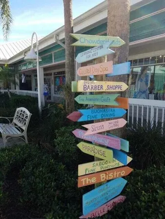 a front view of a house with fountain and entertaining space