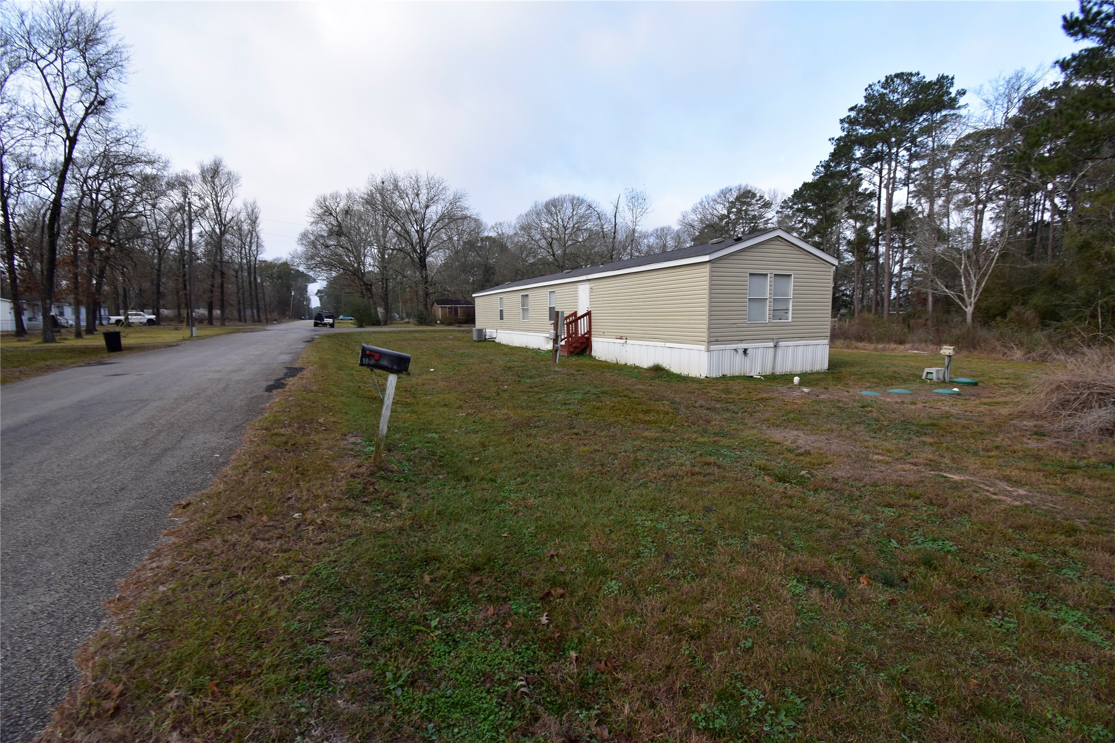 2 Lakeview Lane Huntsville, TX 77340 - Photo 11 of 38 a view of a house with a yard