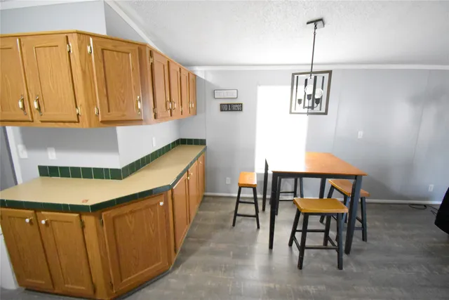 a kitchen with a sink cabinets and window