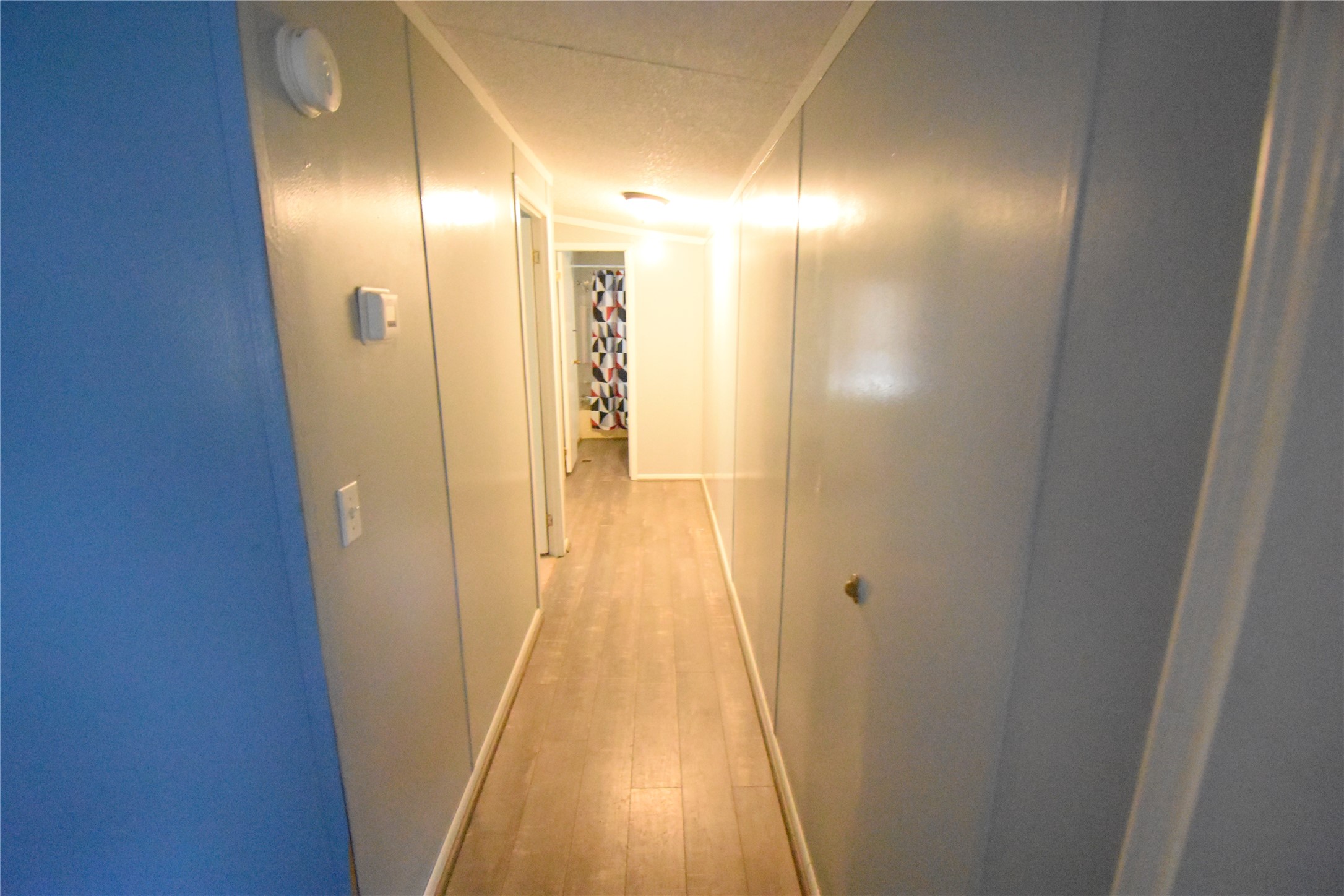 2 Lakeview Lane Huntsville, TX 77340 - Photo 23 of 38 a view of gallery with wooden floor