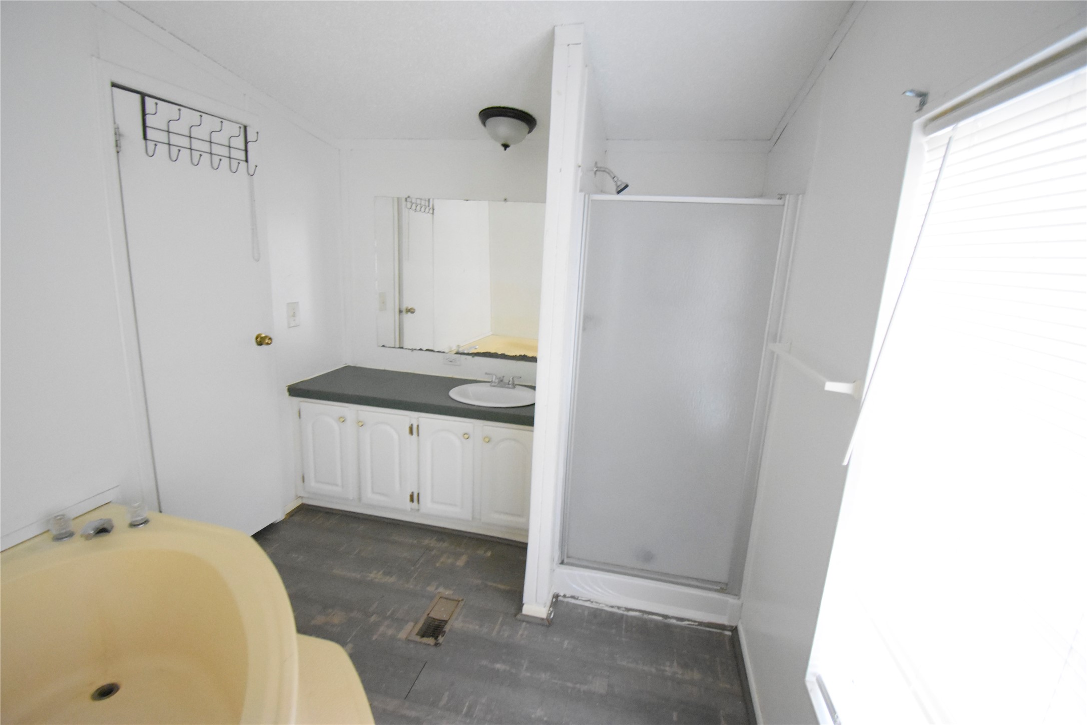 2 Lakeview Lane Huntsville, TX 77340 - Photo 28 of 38 a bathroom with a sink and a mirror