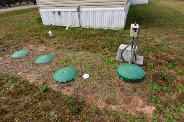 a fire hydrant in the middle of a field