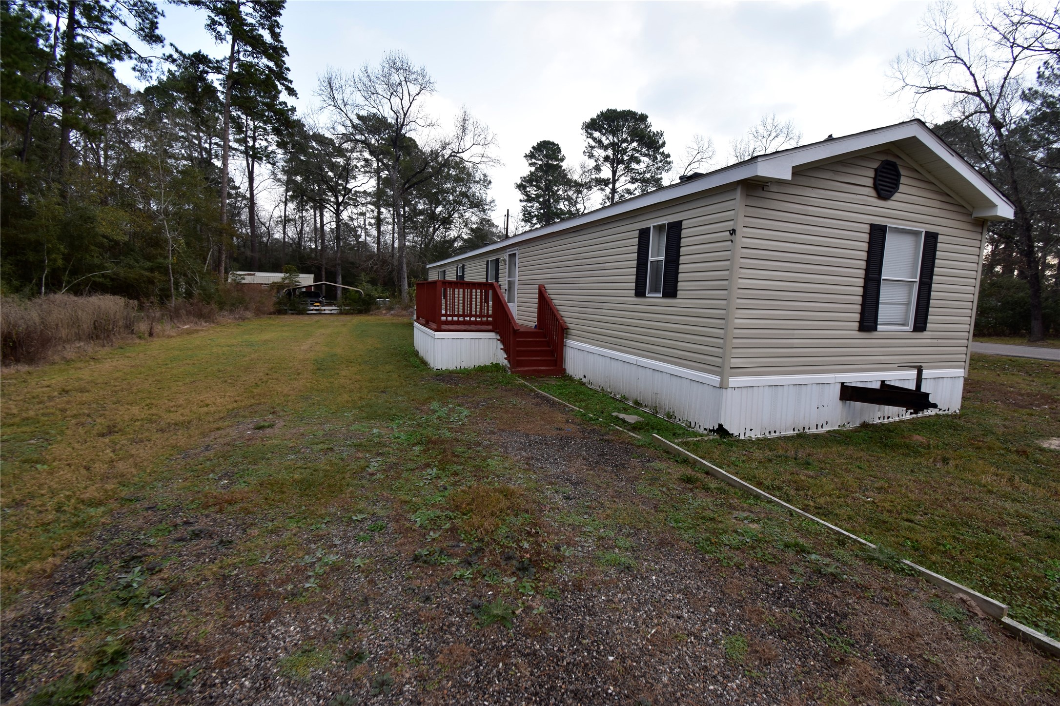 2 Lakeview Lane Huntsville, TX 77340 - Photo 6 of 38 a view of a house with backyard