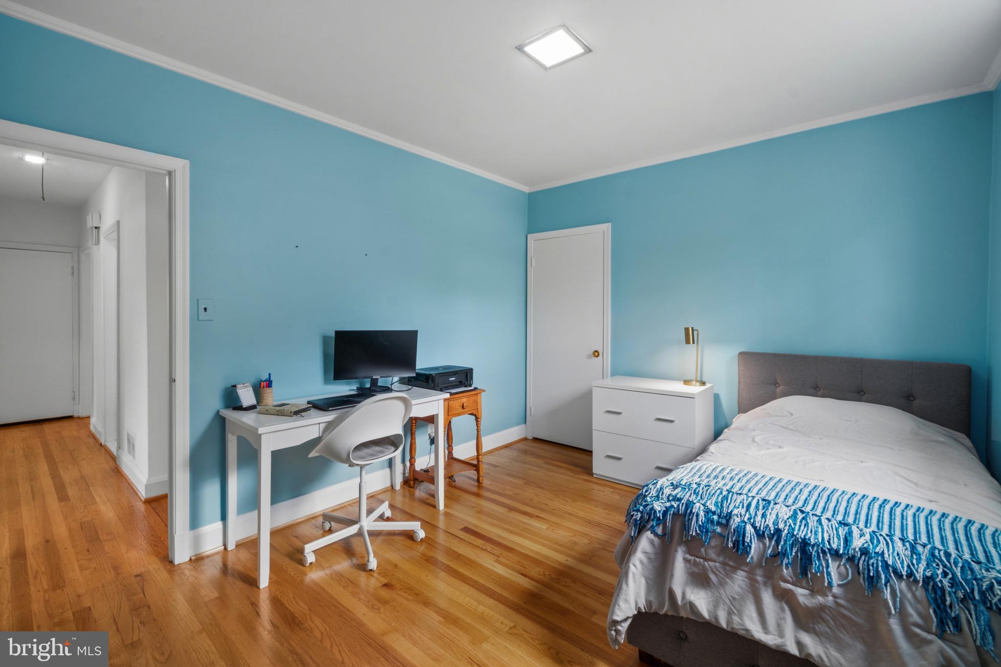 909 Weatherbee Road Towson, MD 21286 - Photo 38 of 51 a bedroom with furniture and a wooden floor