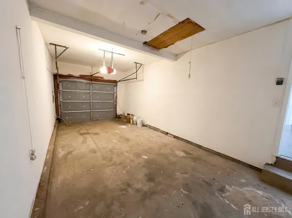 a view of an empty room with cabinets