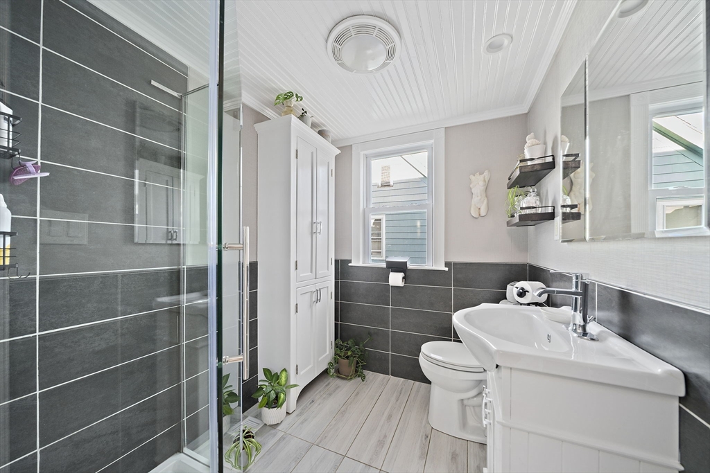 77 Botolph Street Quincy, MA 02171 - Photo 11 of 42 a bathroom with a sink toilet and shower