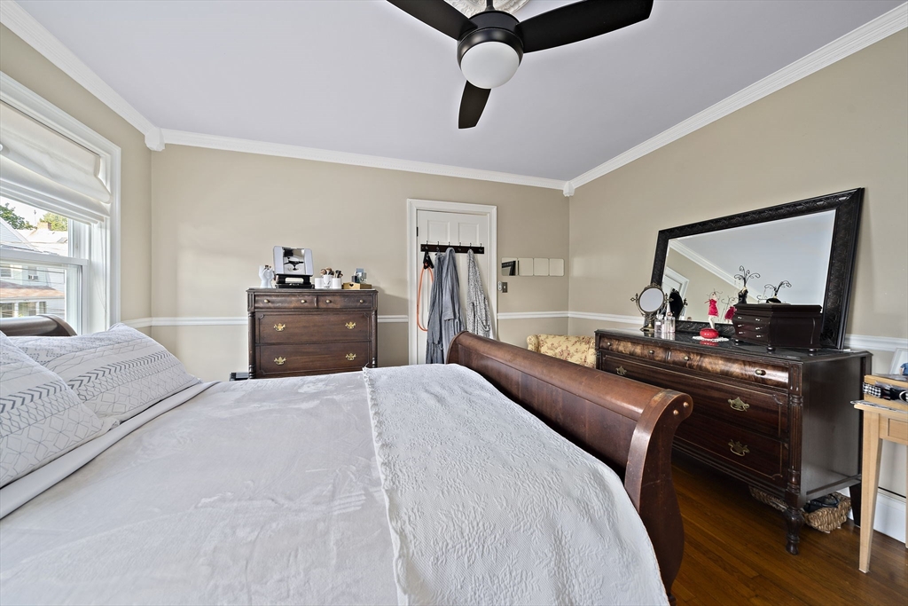 77 Botolph Street Quincy, MA 02171 - Photo 13 of 42 a bedroom with a bed and a dresser