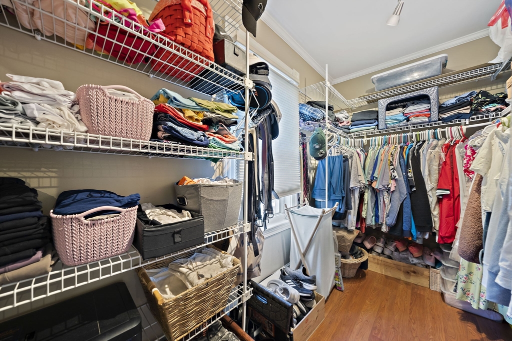 77 Botolph Street Quincy, MA 02171 - Photo 14 of 42 a view of walk in closet with clothes and shoes