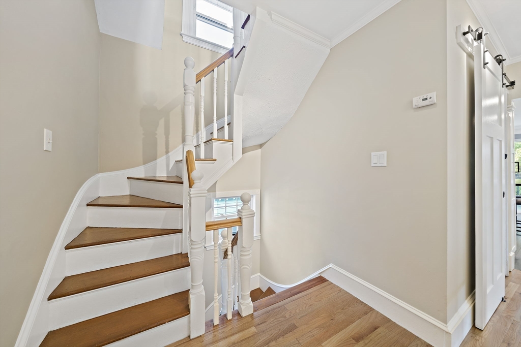 77 Botolph Street Quincy, MA 02171 - Photo 15 of 42 a view of entryway and hall with wooden floor