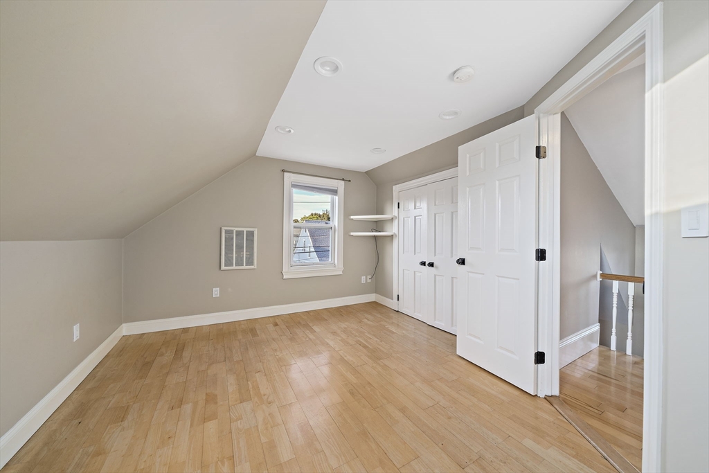 77 Botolph Street Quincy, MA 02171 - Photo 17 of 42 a view of a livingroom with wooden floor and window