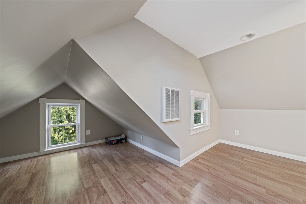 77 Botolph Street Quincy, MA 02171 - Photo 19 of 42 wooden floor in an empty room with a window
