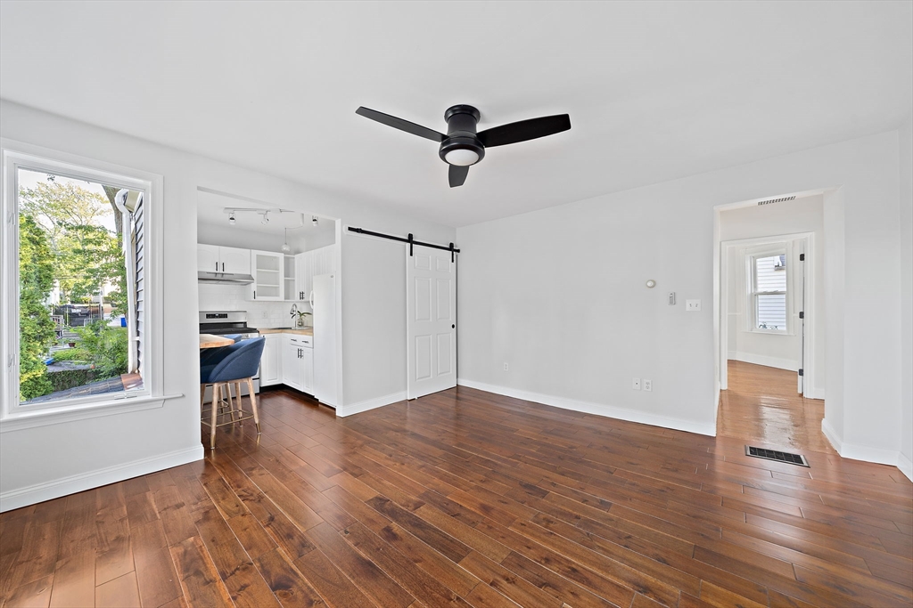77 Botolph Street Quincy, MA 02171 - Photo 23 of 42 a view of empty room with wooden floor and window