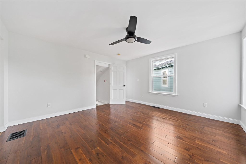 77 Botolph Street Quincy, MA 02171 - Photo 26 of 42 a view of empty room with wooden floor and fan