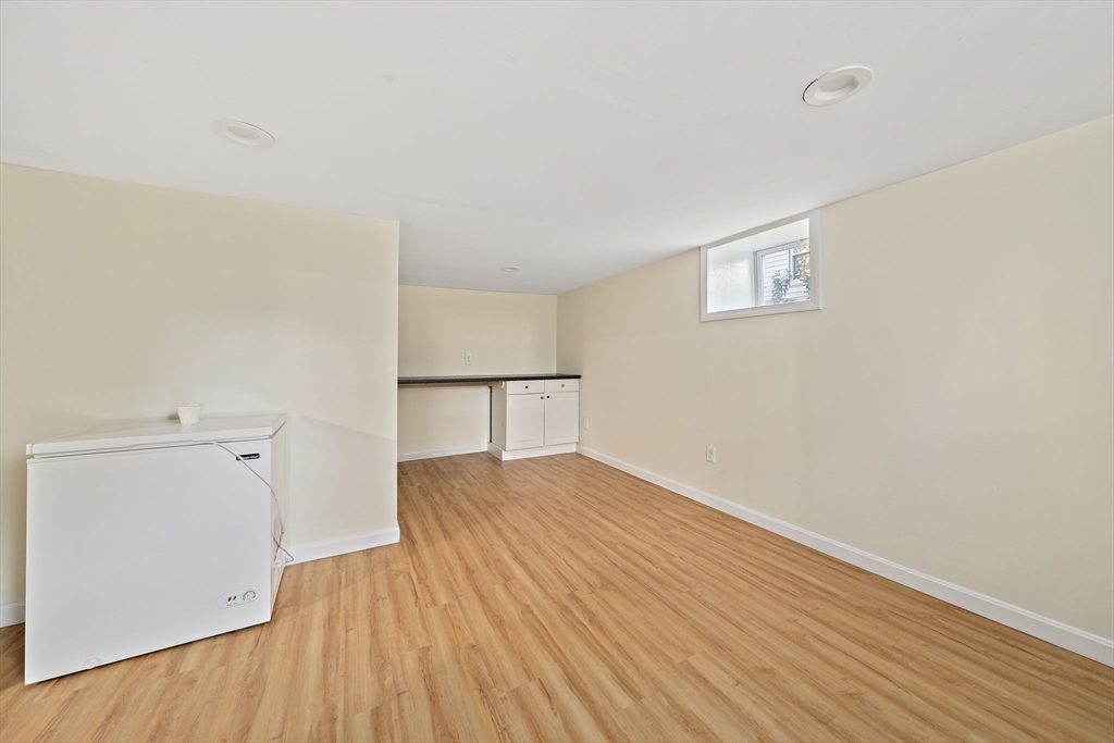 77 Botolph Street Quincy, MA 02171 - Photo 29 of 42 a view of empty room with wooden floor