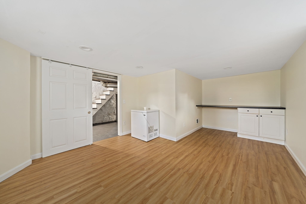 77 Botolph Street Quincy, MA 02171 - Photo 30 of 42 a bedroom with a bed and a dresser