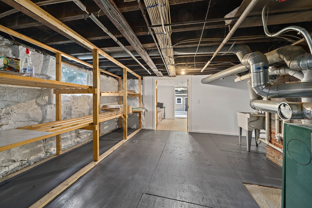 77 Botolph Street Quincy, MA 02171 - Photo 31 of 42 a view of an empty room with wooden floor