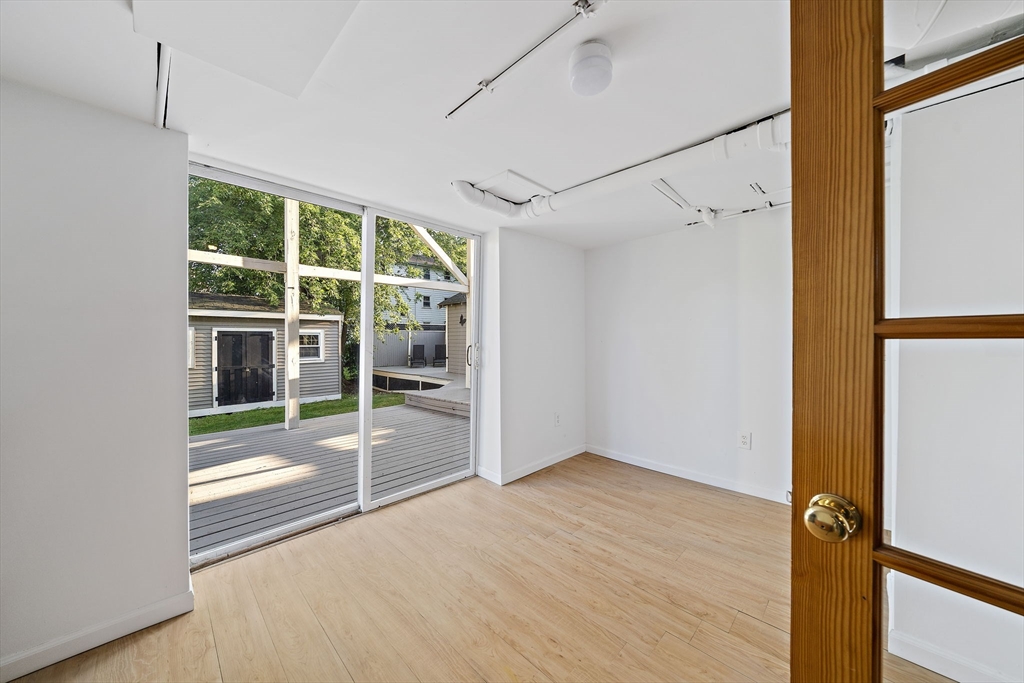 77 Botolph Street Quincy, MA 02171 - Photo 33 of 42 a view of empty room with wooden floor and fan