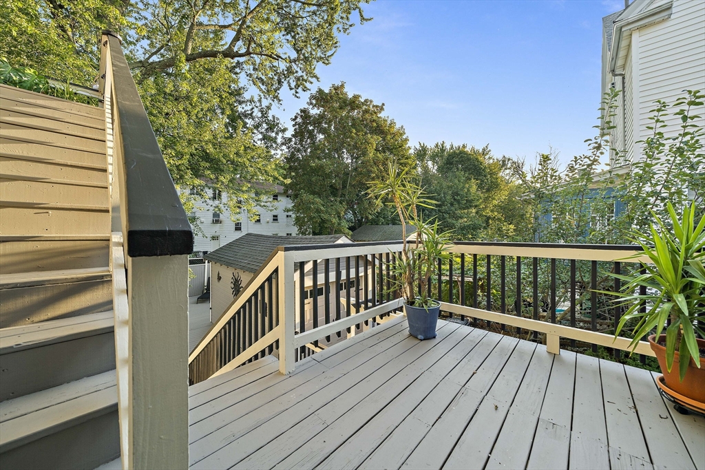 77 Botolph Street Quincy, MA 02171 - Photo 35 of 42 a view of balcony with wooden floor and fence