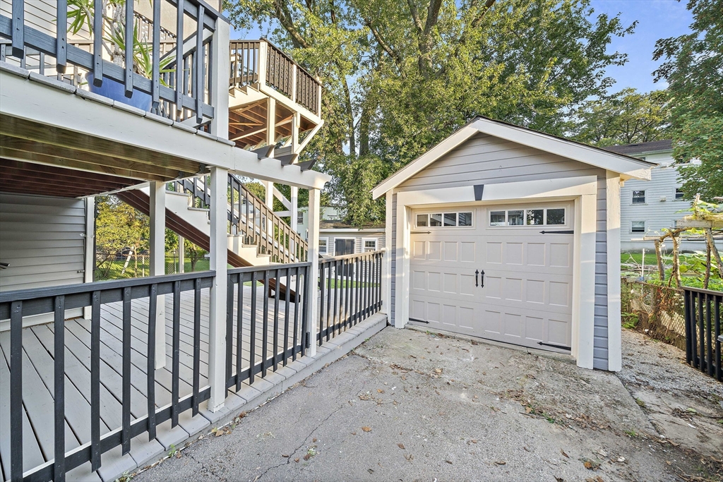 77 Botolph Street Quincy, MA 02171 - Photo 39 of 42 a view of a house with a wooden fence