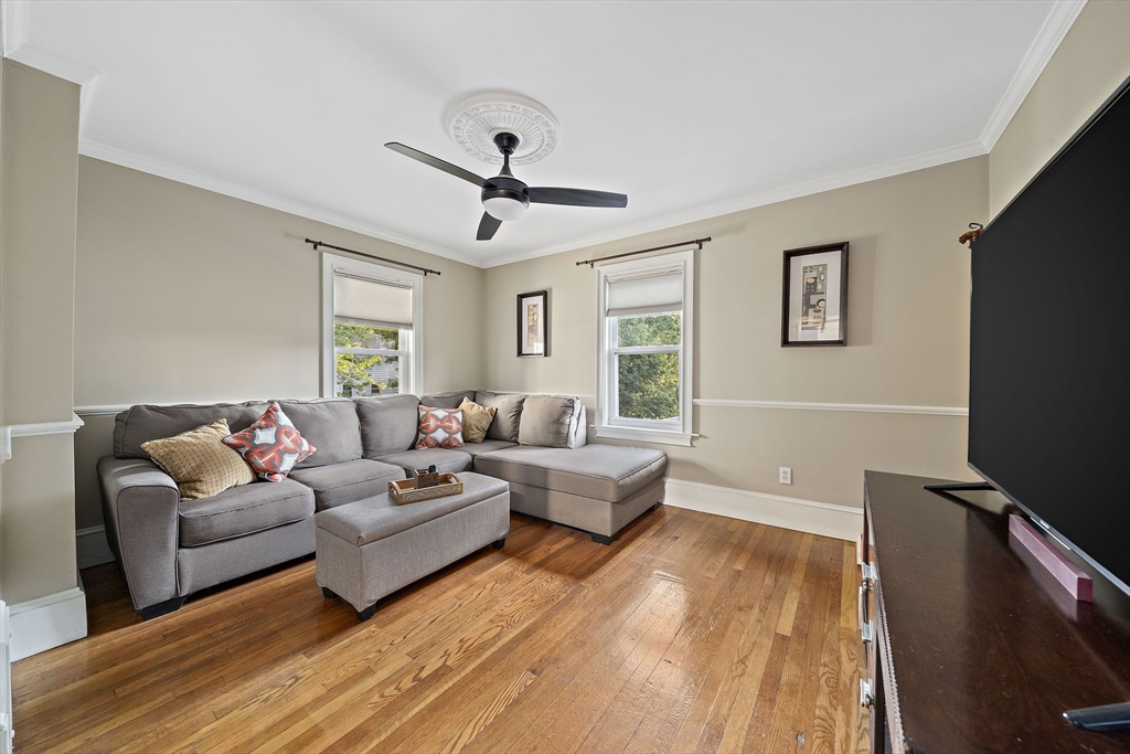 77 Botolph Street Quincy, MA 02171 - Photo 8 of 42 a living room with furniture flat screen tv and window