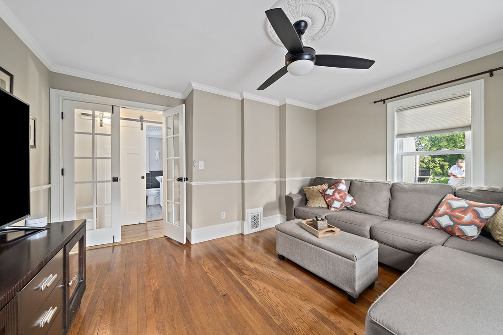 77 Botolph Street Quincy, MA 02171 - Photo 9 of 42 a living room with furniture and a flat screen tv