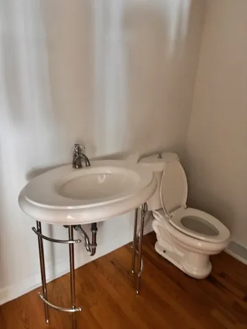 a bathroom with a toilet and a sink