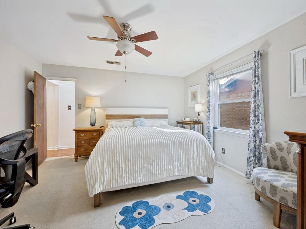 6484 Old Mill Circle Watauga, TX 76148 - Photo 14 of 25 Primary Bedroom featuring light carpet and a ceiling fan