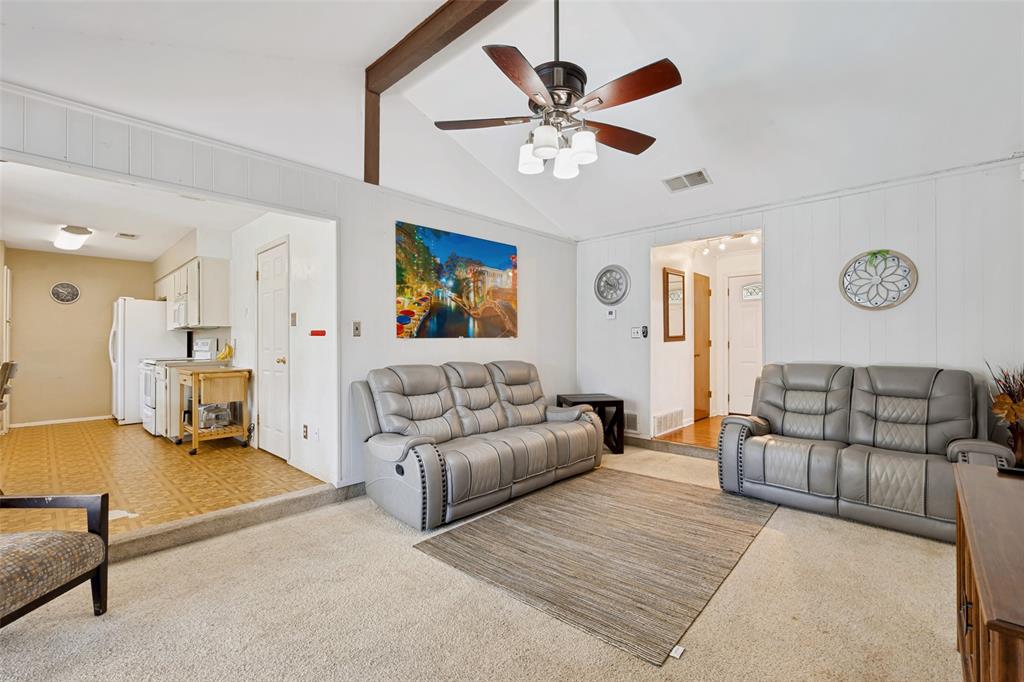 6484 Old Mill Circle Watauga, TX 76148 - Photo 6 of 25 Living area with light colored carpet and a ceiling fan