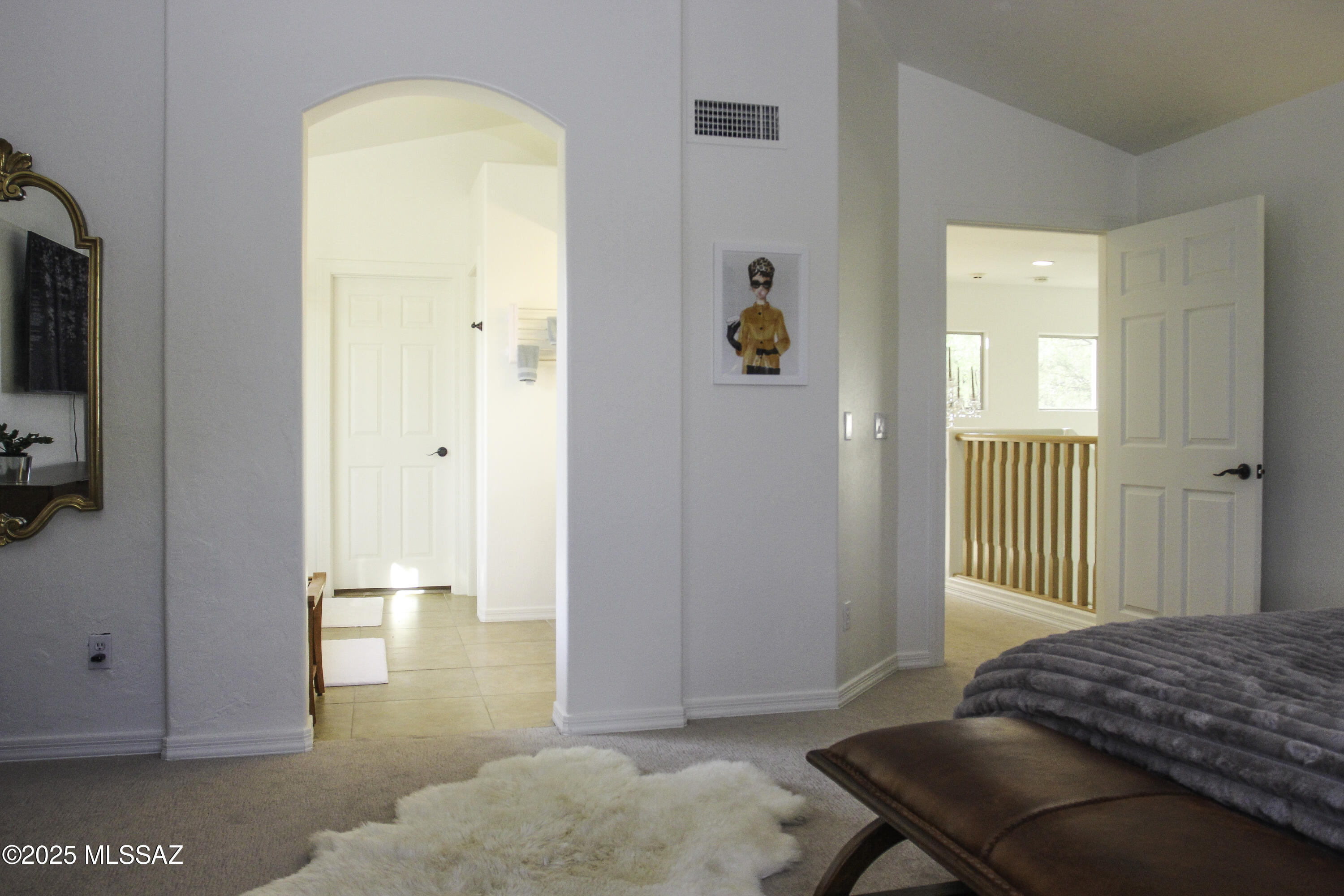 5202 Spring View Drive Tucson, AZ 85749 - Photo 29 of 49 a bedroom with a bed and a chair