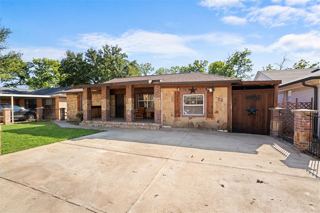 3318 San Marcus Avenue Dallas, TX 75228 - Photo 2 of 18 View of front facade with covered porch, stone siding, and brick siding