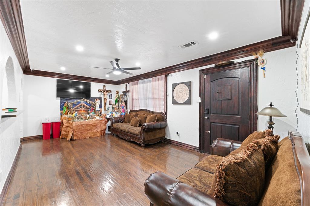 3318 San Marcus Avenue Dallas, TX 75228 - Photo 7 of 18 Living room featuring ceiling fan, hardwood / wood-style floors, and ornamental molding