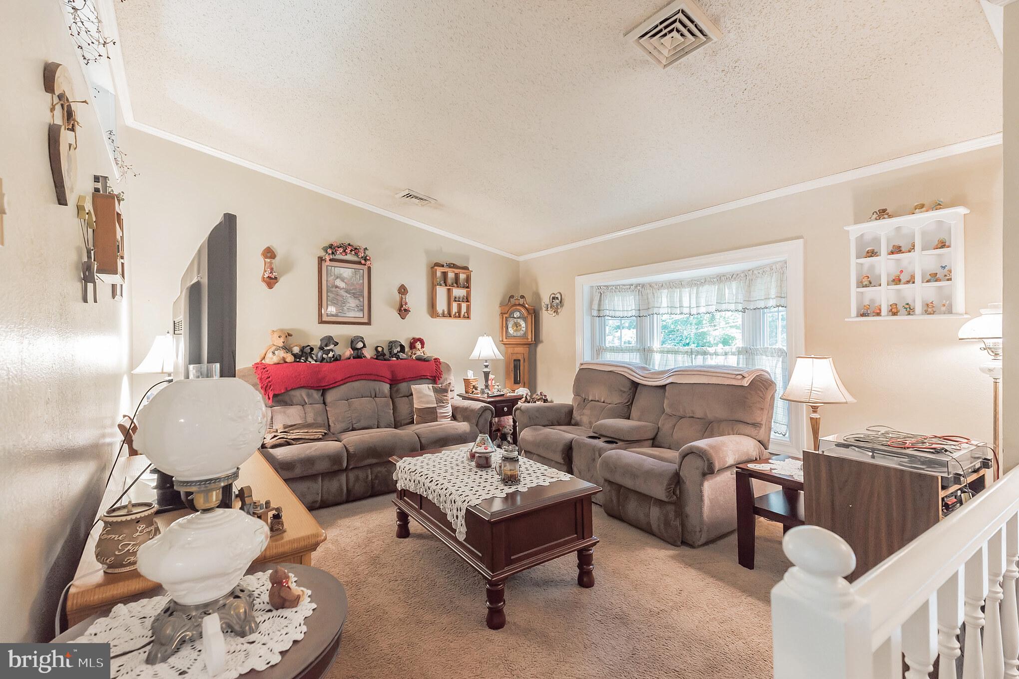 116 Tufts Road Pennsville, NJ 08070 - Photo 11 of 28 Living room with bay window and high ceilings