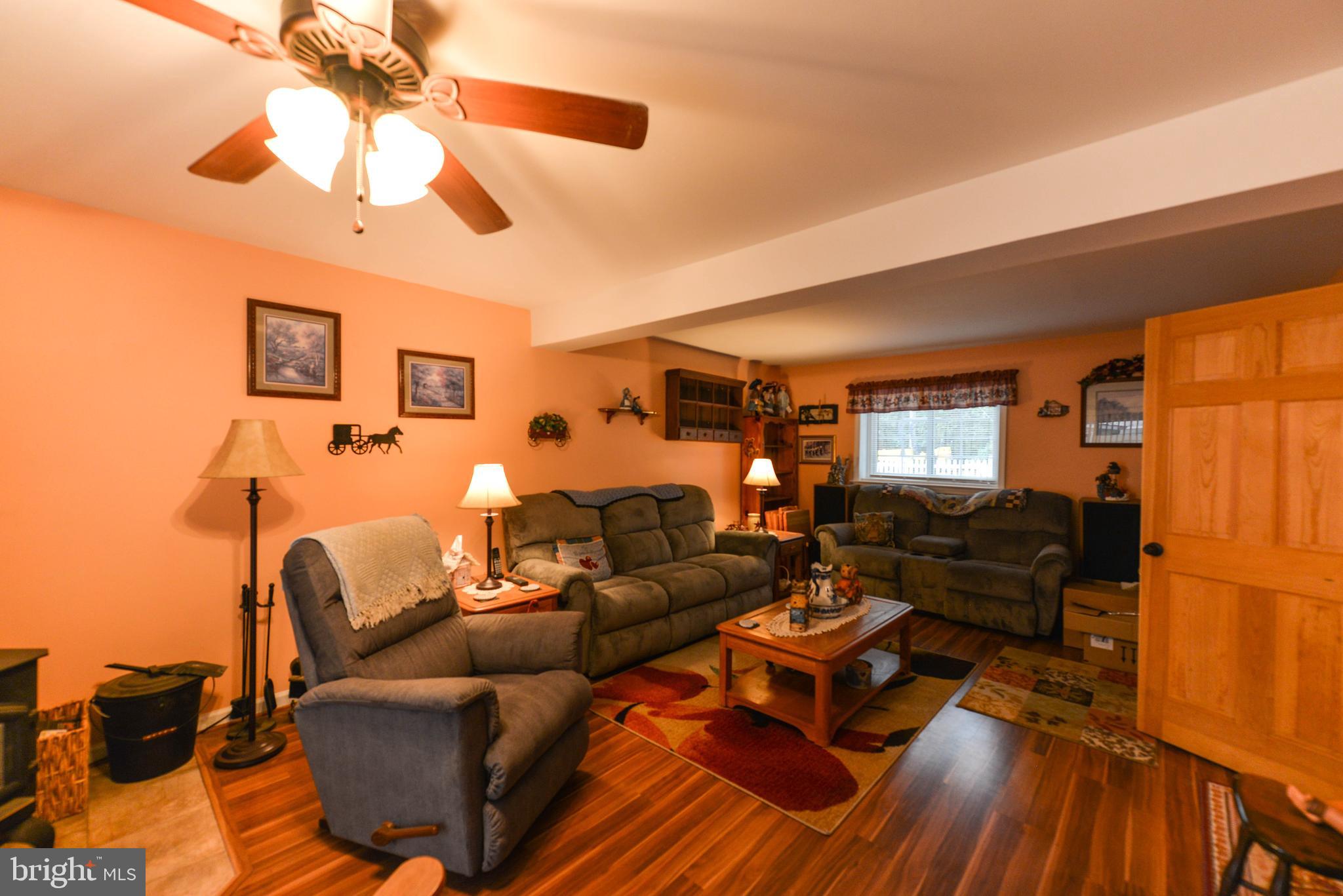116 Tufts Road Pennsville, NJ 08070 - Photo 22 of 28 Family room with enclosed door and 1/2 bath