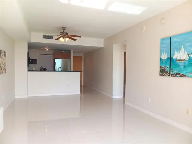view of a living room with furniture and a chandelier
