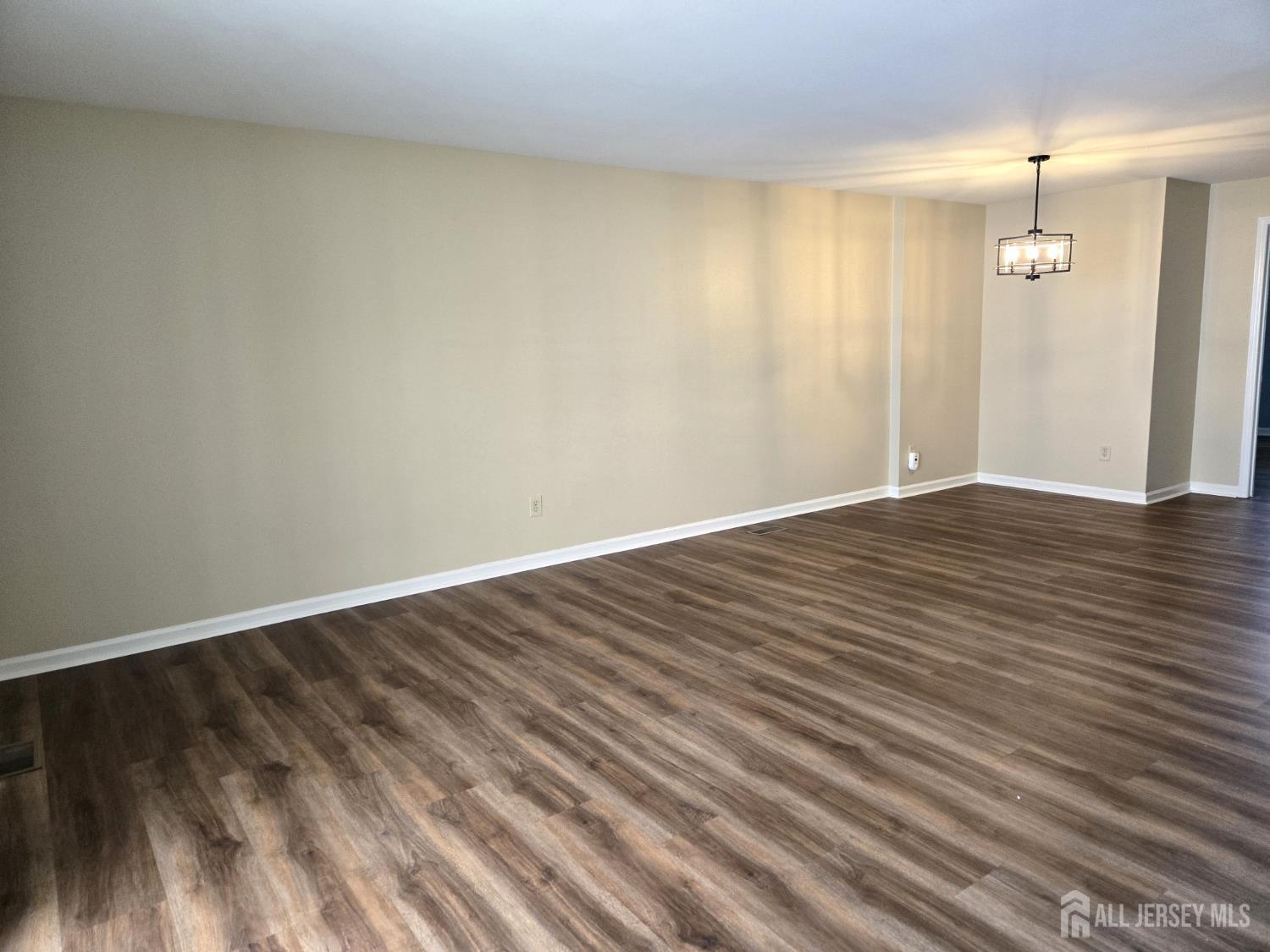 49 Alexandria Way Bernards, NJ 07920 - Photo 3 of 14 a view of an empty room with wooden floor