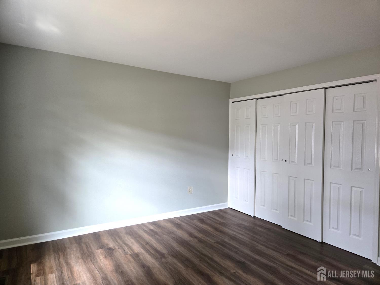 49 Alexandria Way Bernards, NJ 07920 - Photo 8 of 14 a view of an empty room and wooden floor