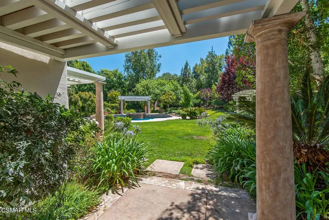 a view of a chair and table in the patio