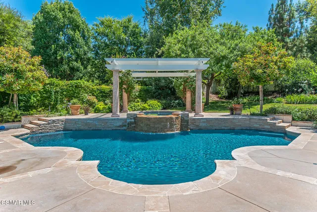 a view of a swimming pool with a patio