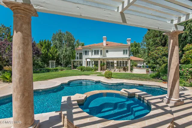 a view of swimming pool with garden