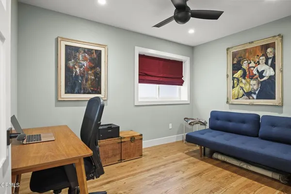 a bathroom with a granite countertop sink a toilet and bathtub