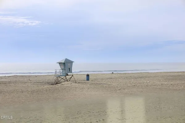 a bedroom with a bed couch and window