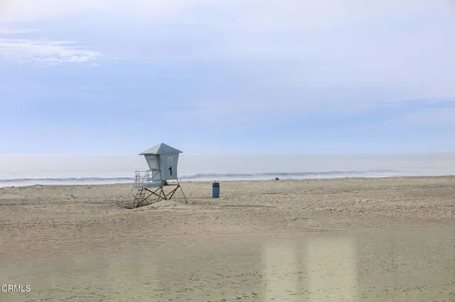 a bedroom with a bed couch and window