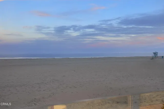 a view of a kitchen with a sink and an umbrella