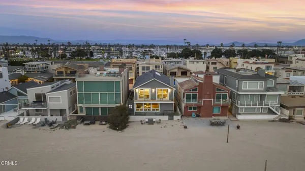 a view of a house with a yard and sitting space