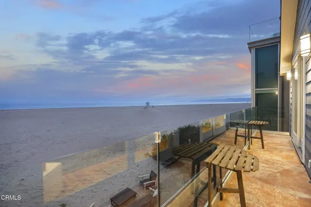 a view of swimming pool with outdoor seating
