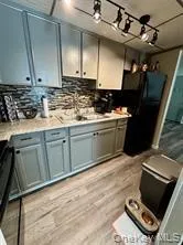 a kitchen with sink cabinets and appliances