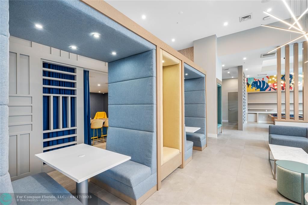 200 Northeast 1st Avenue, Unit 1027 Pompano Beach, FL 33060 - Photo 15 of 18 a view of livingroom with furniture and windows